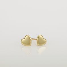 These are small gold heart earrings, handmade of 14k solid gold. Modern yellow gold heart stud earrings, with a highly shiny finish. These heart studs are perfect for every day's wear, and will look great with any style. They will add a chic gold touch and sparkle to your appearance. A wonderful gift for yourself or for someone you love. Heart's size is approx 6.8 x 6.2 mm = 0.26 x 0.24 inch Heart is 1.4 mm thick = 0.05 inch. 14k solid gold ear backs are included. *I can make these earrings in m Minimalist Gold Heart Earrings With Charm, Gold Minimalist Heart Earrings For Everyday, Minimalist Gold Hypoallergenic Heart Earrings, Yellow Gold Double Heart Earrings For Everyday, Dainty Yellow Gold Earrings For Valentine's Day, Tarnish Resistant Yellow Gold Sterling Silver Heart Earrings, Yellow Gold Heart Pendant Earrings, Yellow Gold Heart Pendant Earrings In 14k, Yellow Gold Double Heart Earrings