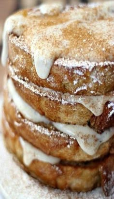 a stack of french toast covered in powdered sugar