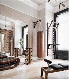 a living room filled with furniture and a punching bag