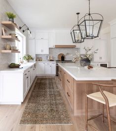 the kitchen is clean and ready to be used for cooking or dining room purposess