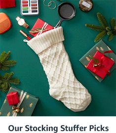 a christmas stocking sitting on top of a green table