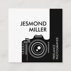 a black and white business card with a photographer's camera on the front cover