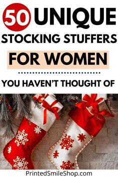 stockings hanging on the wall with text overlay reading 50 unique stocking stuff for women you haven't thought of