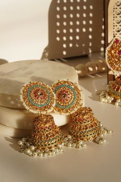 Embrace the elegance and artistry with the beautiful Samreen Jhumka Earrings. Crafted from high-quality brass and adorned with soft colors, these jhumka earrings are designed to make you stand out. Featuring multicolor navratan stones and gold plating with zircon stones, these 3-inch earrings are both chic and statement-making. These elegant jhumka earrings are not just a piece of jewelry but a statement art. With a push pin back and earring support backing, they ensure comfortable wear. Perfect Statement Art, Jhumka Earrings, Bleu Turquoise, Pin Backs, Push Pin, Soft Colors, Turquoise Blue, Gold Plating, Blue Gold