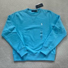 This Polo Ralph Lauren Crewneck Pullover Sweatshirt In Sky Blue Is Such A Great Versatile Piece. It Has Super Soft And Comfortable Fleece Fabric Making It Perfect For Lounging Around, Or You Can Dress It Up A Bit With Jeans Or A Button Down Underneath. Sky Blue Color With White Polo Logo. Nwt, Never Worn. Size Children’s M, But Could Also Fit A Women’s Xs. Feel Free To Make An Offer And Check Out My Other Listings To Bundle! Blue Comfortable Fleece Tops, Cozy Fit Blue Sweatshirt With Ribbed Cuffs, Light Blue Long Sleeve Sweatshirt With Ribbed Cuffs, Cozy Fit Blue Top With Ribbed Cuffs, Blue Top With Ribbed Cuffs And Cozy Fit, Light Blue Fleece Casual Top, Blue Crew Neck Sweatshirt With Cozy Fit, Blue Crew Neck Cozy Fit Sweatshirt, Blue Relaxed Fit Fleece Sweater