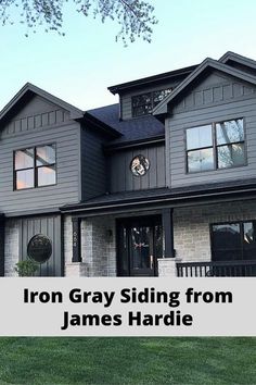 a gray house with the words iron gray siding from james hardie on it's front