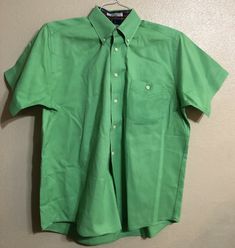 Approximate measurements Pit to pit 23-1/2” Length center back 30” Lightly starched Preowned, so may show signs of previous wear and laundering. Please see photos for actual condition and description. Thanks for looking! Classic Green Shirt With Pockets, Classic Green Short Sleeve Shirt, Classic Green Collared Short Sleeve Shirt, Fitted Green Button-up Short Sleeve Shirt, Green Cotton Formal Shirt, Fitted Green Cotton Short Sleeve Shirt, Green Cotton Short Sleeve Shirt With Buttons, Shirt Short Sleeve, Button Front Shirt