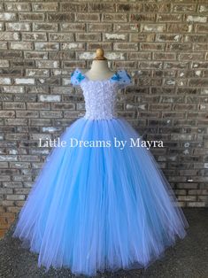 Dear customers, current processing time is 3-5 business days, if you need your order to arrive faster you can upgrade shipping at checkout Welcome to Little Dreams by Mayra This dress is absolutely adorable, puffy and adorable! It has three layers of tulle that makes it very puffy and princess style, skirt is made with turquoise tulle and glitter turquoise tulle Dress is a perfect match for a frozen party! or can be custom ordered to match your wedding color theme, Perfect for flower girls, pict Blue Fitted Tulle Princess Dress, Fitted Blue Tulle Princess Dress, Blue Princess Dress Aesthetic, Princess Style Tutu Dress For First Communion, Blue Princess Dress With Tulle Skirt For Wedding, Fitted Light Blue Tulle Princess Dress, Fitted Blue Ball Gown With Tulle Skirt, Princess Style Fitted Pageant Dress With Tulle Skirt, Fitted Blue Princess Fairy Dress