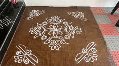 a brown mat with white designs on it