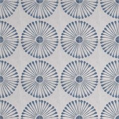 a blue and white wallpaper with an intricate design