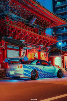 a car parked in front of a building with red and blue lights on it's side