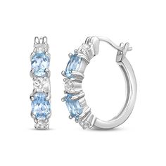 These petite hoop earrings bring just the right touch of sparkle to your day or evening look. Created in sterling silver, each earring features oval-cut Swiss blue topaz that alternate with round-cut white lab-created sapphires. These hoops secure with hinged backs. Oval Huggie Earrings Fine Jewelry, Anniversary Birthstone Hoop Earrings, Oval Cubic Zirconia Hoop Earrings Fine Jewelry, Sterling Silver Oval Hoop Earrings Fine Jewelry, Sapphire Hoop Earrings, String Earrings, White Lab, Swiss Blue Topaz, Topaz Stone