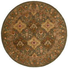 a round rug with an ornate design on the center and sides in green, gold and red colors