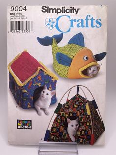 an image of a magazine cover with cats in their house and cat houses on it