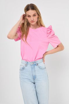 Get ready to turn heads in our Mini Ruffle Puff Sleeve T-Shirt! This must-have top combines playful style with comfort and versatility. The bodice is crafted from a mix of fabrics, with poplin being the star. The puffy short sleeve features a mini ruffle detail, adding a touch of femininity to the classic design. The round neckline complements the overall look, making it a perfect choice for any occasion. From casual days to special events, this top is a wardrobe essential. Optimize your style a Spring Cotton Short Sleeve Top With Ruffle Sleeves, Casual Cotton Ruffle Sleeve Top, Casual Cotton Short Sleeve Top With Ruffle Sleeve, Casual Cotton Short Sleeve Top With Ruffle, Ruffled Cotton Short Sleeve Top, Ruffle Sleeve Cotton Top With Ruffles, Cotton Short Sleeve Top With Ruffle Sleeves, Trendy Cotton T-shirt With Ruffle Sleeves, Spring Cotton Ruffle Short Sleeve Top