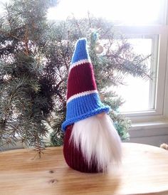 a gnome hat sitting on top of a wooden table