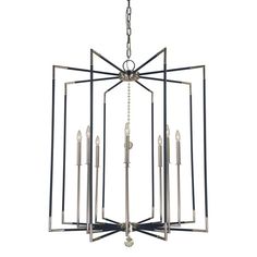 an art deco chandelier with four lights hanging from the ceiling, and one light fixture