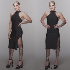 a woman in black dress with tattoos on her arms and legs, posing for the camera