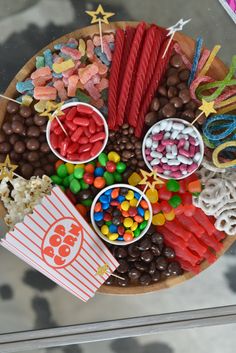 a wooden plate topped with lots of candy and candies