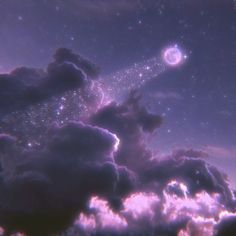 the sky is filled with clouds and stars