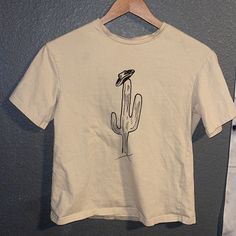 Cactus Shirt Womens T-Shirt Good Condition, Never Worn Color-Tan/Cream Size-Xs Cute Cactus Design With Cowboy Hat! Cute For Any Occasion! Smoke Free Home. Cowboy Tshirt Designs, Cowboy Cactus, Cactus Shirt, Shirt Inspiration, Cute Cactus, Cactus Design, Womens T Shirt, Shein Tops, Cowboy Hat