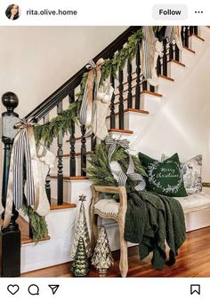 the stairs are decorated with christmas garlands and stockings