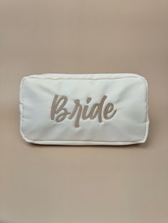 the bride name tag is white and gold