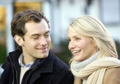 a man and woman smile at each other