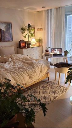 a bedroom with a large bed and lots of plants