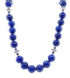 This gorgeous necklace of round lapis lazuli beads with sapphire and white gold accents is the epitome of style and sophistication! 10mm round, beautifully matched lapis with their high-polish and stunning royal blue color have been arranged with 18k white gold rondels, faceted blue sapphire beads and white gold rondels. The larger white gold rondels are set with tiny sparkling sapphires that complement the lapis perfectly, and the white gold accents have a lovely stardust finish. Elegant Round Beaded Lapis Lazuli Necklace, Round Lapis Lazuli Necklace With Faceted Beads, Lapis Lazuli Faceted Round Bead Necklaces, Royal Blue Lapis Lazuli Necklace With Round Beads, Sapphire-colored Lapis Lazuli Round Beaded Jewelry, Lapis Lazuli Beads, Royal Blue Color, White Gold Necklaces, Ring Pendant Necklace