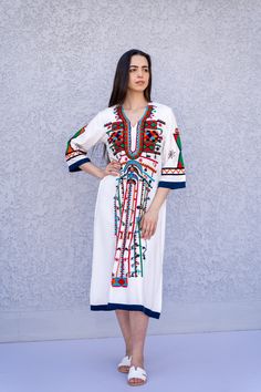 "This beautiful bohemian embroidered tunic dress is surely going to add life and oriental charm to your closet. The dress is made of Egyptian cotton which is widely renowned for its quality and texture. The dress is light and extremely soft and can be used on many occasions - beach, lounge, or even in your home to feel comfortable. Fabric : 70% Egyptian Cotton; 30% Polyester. Tunic measurements in inches : Small (Size 4/6 USA) Bust : 36-37 Hip : 40-41 Medium (Size 8/10 USA) Bust : 39-40 Hip : 45 Summer Bohemian Kaftan With Embroidered Hem, Bohemian Summer Kaftan With Embroidered Hem, Bohemian Kaftan With Embroidered Hem For Summer, Traditional Multicolor Dresses With Boho Print, Bohemian Embroidered Long Sleeve Dress For Beach, Bohemian Long Sleeve Embroidered Dress For Beach, Summer Multicolor Embroidered Straight Kurta, Festive Embroidered Midi Length Dress, Summer Straight Kurta Dress With Multicolor Embroidery