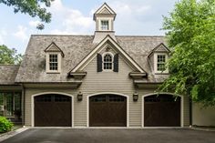 a house with two garages and three windows