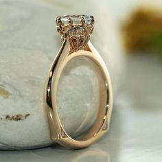 Antique Modified Design- A single round brilliant 7mm Aquamarine is set creatively in the center of a basic solid 14k rose gold with two VS diamond on each side of a knife edge band. This eight-prong setting is perfect for a spectacular night out with your love ones. R101E-7mm-AQUA-14KRCenter Stone*Natural AAA Quality Aquamarine*Aqua Blue, Eye-clean (VS1 clarity) *7x7 mm Round Brilliant cut *Approx. gemstone weight: 1.20 caratsSide Stone*Conflict Free Natural White Diamonds*Round Brilliant Cut * Rose Gold Ring With Tension Setting, Timeless Rose Gold Diamond Ring With Tension Setting, Luxury 14k Rose Gold Wedding Ring With Center Stone, Rose Gold Moissanite Diamond Ring With Brilliant Cut, Rose Gold Moissanite Solitaire Jewelry, Promise Jewelry In Rose Gold With Tension Setting, 14k Rose Gold Diamond Ring With Tension Setting, Rose Gold Diamond Ring With Tension Setting, Rose Gold Diamond Ring With Tension Setting For Anniversary