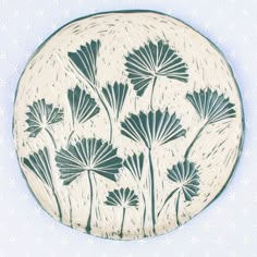 a blue and white plate with flowers on it