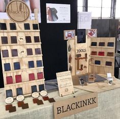 the table is set up to display different types of leathers and other items for sale