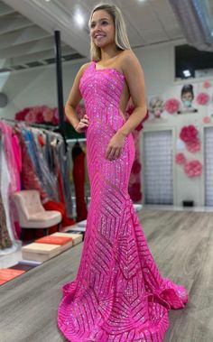 Jovani 06017 Long Mermaid Prom Dress. This Jovani 06017 prom gown features a fit and flare silhouette in geometric sequins, detailed with a one-shoulder neckline and sheer plunging sides. Soft godets add volume to this glitter formal dress, finished with a horsehair hem and lush sweeping train. Available Sizes:00-24 Available Color: Red, Purple, Blush, Neon Hot Pink, Neon Orange, White, Pale Green Glitter Formal Dress, Neon Prom Dresses, Jovani Prom, Prom Dresses Long Mermaid, Mermaid Prom Dress, Custom Prom Dress, Pageant Gowns, Dresses 2023, Red Sequin