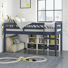 a child's bedroom with a bunk bed and toy train set on the floor