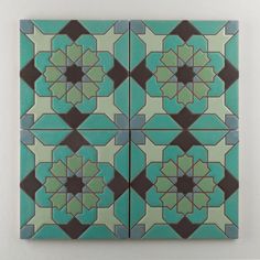 an artistic tile design in green and brown