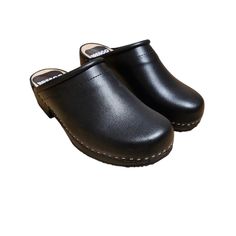 Experience Unmatched Comfort and Style;  Black Wooden Clogs crafted from natural cowhide leather, our 2mm-thick black colored clogs redefine comfort and elegance. Glide through your day with ease, knowing these wooden shoes provide the perfect balance of support and flexibility. Premium Material, Superior Quality;  Step into luxury with our closed toe wooden clogs, meticulously designed for clogs women. The durable upper crafted from natural cowhide leather promises longevity, while the real wood and PU rubber bottom offer stability without the traditional clacking sound. Elevate your footwear collection with these premium, versatile clogs. Unleash Your Style Statement;  With their sophisticated design and attention to detail, our Swedish clogs in black leather are more than just shoes - t Black Comfortable Clogs With Leather Sole, Comfortable Black Clogs With Leather Sole, Black Leather Clogs With Rubber Sole, Natural Leather Sole Slip-on Clogs, Natural Color Slip-on Clogs With Leather Sole, Casual Closed Toe Wooden Clogs, Casual Wood Closed Toe Clogs, Comfortable Leather Clogs With Wooden Heel, Leather Closed Toe Clogs With Rubber Sole