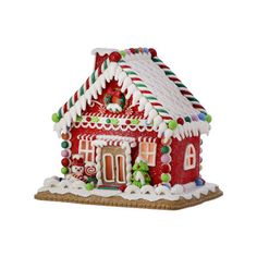 a gingerbread house with candy on the roof