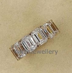 an emerald cut diamond ring with baguetts