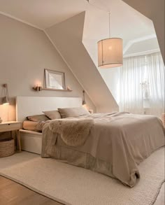 a bedroom with a bed, nightstands and two lamps