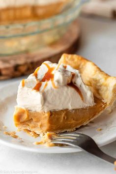 a slice of pumpkin pie with whipped cream on top