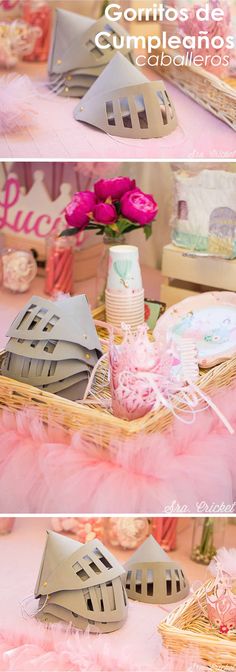 the table is decorated with pink feathers and paper decorations