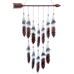 a wind chime with feathers hanging from it's side on a white background