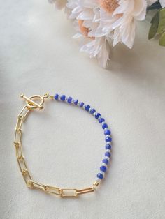 This beautiful bracelet is made using sapphire, freshwater pearls, 14k gold plated chain, and 24k gold plated findings. This bracelet is perfect to wear on a wedding or even daily use! You can choose the length of it in the variations, if you can't find the length that fits you, f eel free to send me a message!  Things included in your package (bubble mailer) : -your order -thank you card -extras (stickers or candy) Make sure you follow my Instagram @jewelrybynausheen for amazing jewelry posts and shop updates! 14k Gold Filled Beaded Chain Bracelets As Gift, Elegant Blue Chain Bracelet As Gift, Elegant Blue Chain Bracelet For Gift, Dainty Blue Beaded Chain Bracelet, Dainty Blue Chain Jewelry, Everyday Blue 14k Gold Filled Bracelets, Crystal Chain Bracelet Gift, Elegant Blue Chain Bracelet For Everyday, Everyday Blue Bracelet With Adjustable Chain