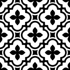 a black and white tile pattern with an intricate design on the bottom half of it