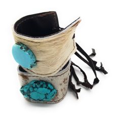 Show off your boho-chic style with this women's leather cuff bracelet! This piece of genuine leather cuff jewelry features a turquoise slab sewn to the center. This women’s cuff bracelet is handcrafted with genuine leather and hide, adding a southern touch to your boho-chic style. Adjusts with leather ties and a wood bead that can be moved to accommodate a variety of wrist sizes. The entire length of this women's cuff bracelet is 1.5" in width, and it adjusts with to the smallest size approximat Womens Cuff Bracelets, Lace Cuffs, Cuff Jewelry, Turquoise Leather, Boho Accessories, Leather Cuffs Bracelet, Leather Cuffs, Boho Chic Fashion, Vintage Lace