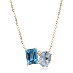 This blue topaz and diamond accent pendant necklace makes a stylish statement with luminous gemstones in an alluring modern design. Crafted in glistening 10K yellow gold, this pendant features one emerald cut blue topaz artistically set alongside one oval blue topaz in eye-catching shades of blue, complemented by an accent diamond. | Blue Topaz and Diamond Accent Pendant Necklace | 10K Yellow Gold | Size 18" | Helzberg Diamonds Modern Gemstone Jewelry, Floating Gemstone Necklace, Dainty Sapphire Necklace, Oval Diamond Necklace, Dainty Gemstone Necklace, Blue Gemstone Necklace, Emerald Necklace Pendant, Blue Pendant Necklace, Gem Pendant