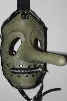 Express shipping is available.This listing is for one of my handmade Halloween mask. It has leather straps with metal buckles and eyelets as well as a working zipper, hand stitching and rivets. This mask is made to fit an adult males head between 22-24 inches. Please do not buy if you don't plan on paying. Each paint job may be slightly different but I try to keep them all the same. Than mask is a forest green/yellow. Shipping in the states is free but anywhere else in the world will be 65 USD. Slipknot Halloween Costumes, Medieval Style Masks For Cosplay And Masquerade Events, Medieval Style Masks And Prosthetics For Masquerade Cosplay, Medieval Masks And Prosthetics For Halloween Cosplay, Medieval Masks For Halloween Costume Party, Medieval Style Masks For Halloween Fantasy Events, Handmade Gothic Masks And Prosthetics For Costume, Medieval Masks And Prosthetics For Cosplay And Halloween, Medieval Style Mask For Costume